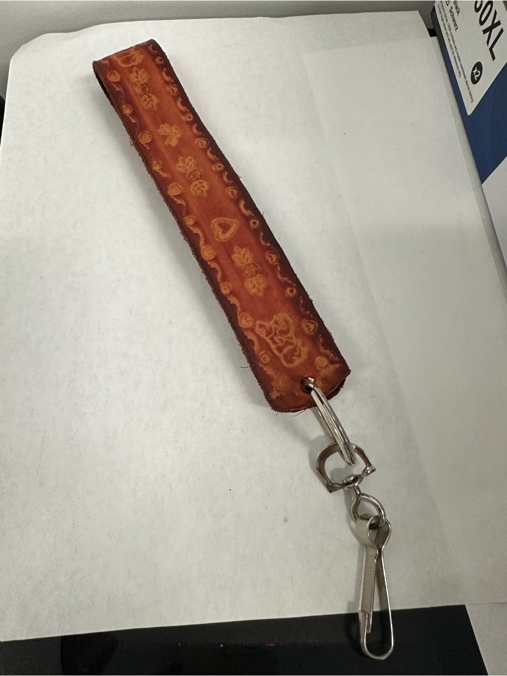 Vintage-style embossed cowhide keychain Western-inspired floral design 1.25/7.5”